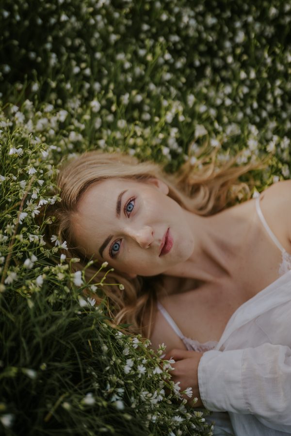 Lying in flowers, soft light